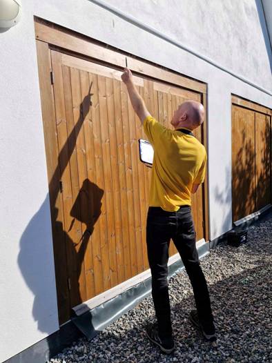 Red Nelson inspecting a building